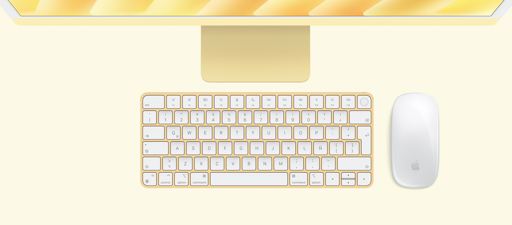 Vista panorámica de una iMac amarilla con mouse y teclado a juego